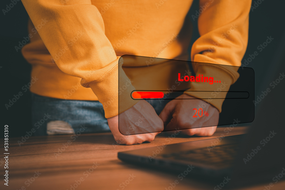 Poster Man using laptop for download software and waiting to loading digital business data form website, concept of waiting for load of loading bar.