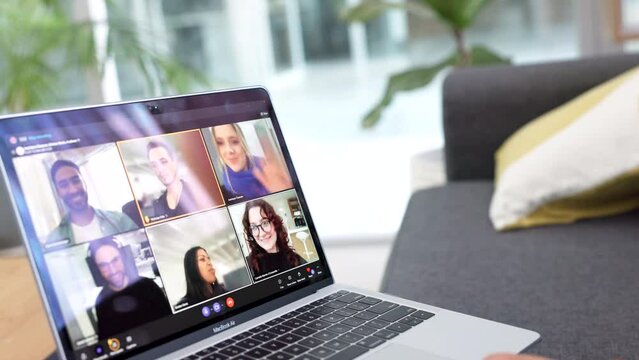 A video call on the laptop and online work meeting at home with a team. Social distance, business meeting and working remote with diverse people. Computer, virtual conversation and business people