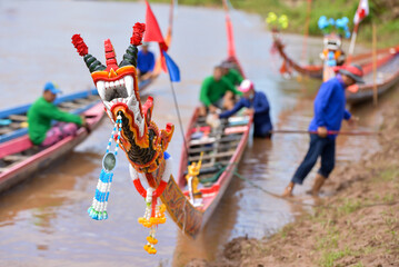 Long boats are used for water sports competitions.
shaped prow
Like a Naga.
Long boat race, Nan...