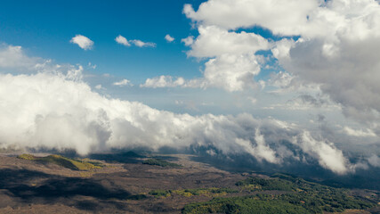 Fototapeta na wymiar Aerial view on cloudscape and sloops of Mt. Etna, Sicily