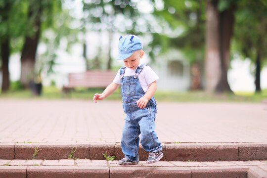 baby jeans jumpsuit boy walks in summer