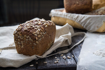 Freshly baked traditional bread on wooden table