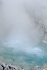 Turquoise hot boiling water in geyser in mountain valley at Tamagawa Onsen Hot spring in Semboku city, Akita prefecture, Tohoku region, northern Japan, Asia