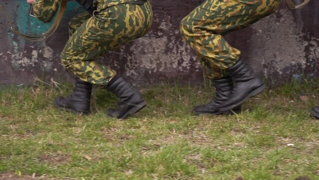 feet of soldiers who are sneaking. slow motion. close-up