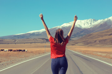 Fototapeta na wymiar girl road hands raised up mountains concept, road freedom active adventure