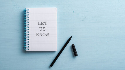 Let us know sign written in spiral notebook - obrazy, fototapety, plakaty