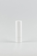 white lipstick tube on white background. white unbranded lipstick tube mock up. branding identity lipstick tube mockup vertical concept. blank label