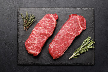 Fototapeta na wymiar Prime marbled beef steaks. Raw striploin steak