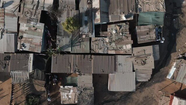 Poverty.Inequality.Aerial zoom out circular view of densely over crowded and populated African townships,slum,squatter camp, South Africa