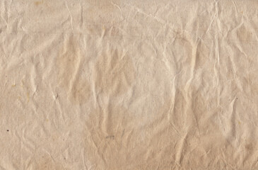 Old vintage rough crumpled paper with scratches and stains texture