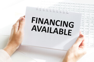 Businessman showing business concept on tablet standing in office FINANCING AVAILABLE