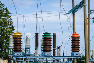 High voltage power transformer substation.High voltage electric power transformers in the blue...