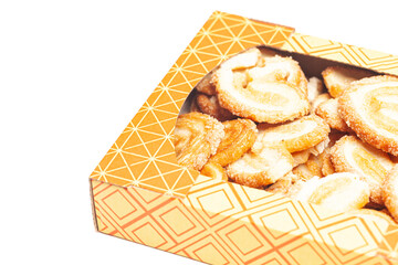 Heart-shaped cookies in box isolated on white background