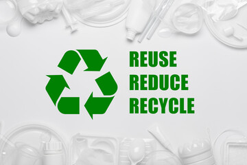 Recycling symbol with reuse reduce recycle slogan surrounded by single use plastic objects, packaging plastic products - 531879300