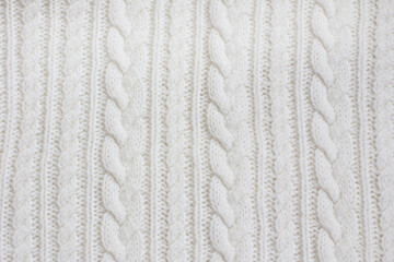 patterned knitted fabric in the Irish style. The texture of knitted fabric knitted with knitting...