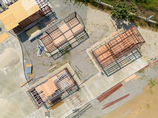 Aerial photo top to down view of tiny houses built with metal profile