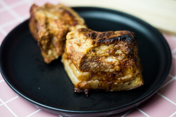 Side view of crispy golden pork belly. Deep fried crispy pork belly