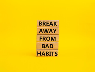 Break away from bad habits symbol. Wooden blocks with words Break away from bad habits. Beautiful yellow background. Business and Break away from bad habits concept. Copy space.
