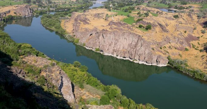 Twin Falls Idaho Snake River kayaks. Shoshone Falls waterfall on the Snake River, Idaho. Irrigation and hydroelectric power stations is economic impact to west. higher than Niagara Falls.