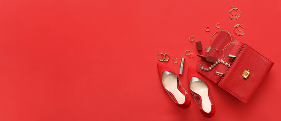 Fashionable woman's shoes, bag and accessories on red background with space for text, top view