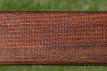 wooden board against green grass
