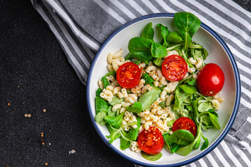 pasta salad tomato, vegetables second course healthy meal food snack diet on the table copy space food background rustic top view keto or paleo diet veggie vegan or vegetarian food