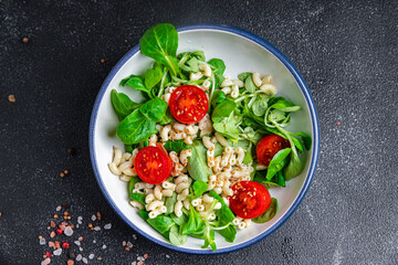 pasta salad tomato, vegetables second course healthy meal food snack diet on the table copy space food background rustic top view keto or paleo diet veggie vegan or vegetarian food