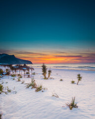 sunset at sea in snowy weather