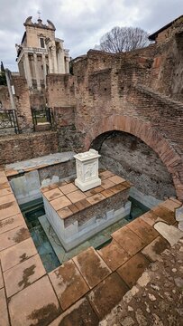 Vertical shot of the Spring of Juturna at the Roman Forum in Rome, Italy