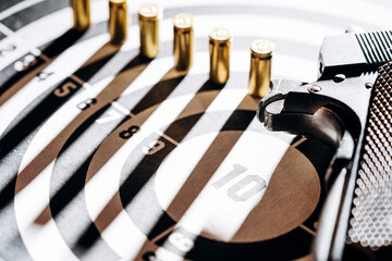 Gun and many bullets shooting targets. Training for aiming and shooting accuracy