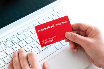 Private health insurance with laptop concept
