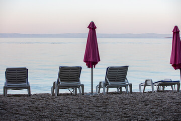 sun beds on the empty beach