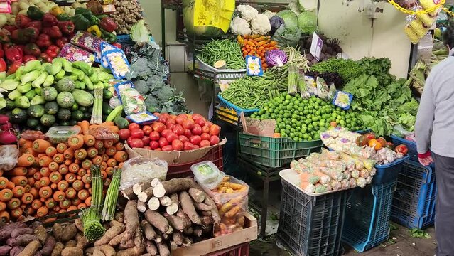 Video of a vegetable and fruit market. Carrots, Yuccas, Asparagus, bell peppers, tomatoes, limes and many more foods can be seen. Recorded in 4k Quality, 60 fps in Lima, Peru.