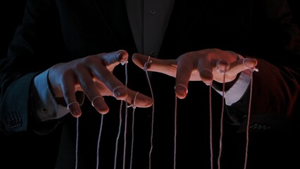 Man hands with strings on fingers. Hands close up pulling strings. Man in business suit manipulates...