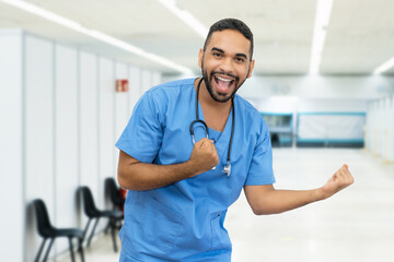 Cheering hispanic male nurse or doctor