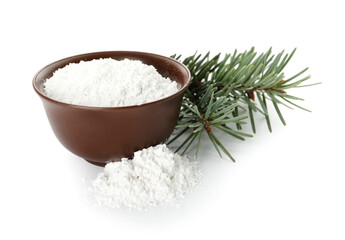 Bowl of tooth powder with coniferous branches on white background