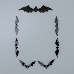Bats lined up in a rectangle on a white background with copy space. Minimal aesthetic concept.