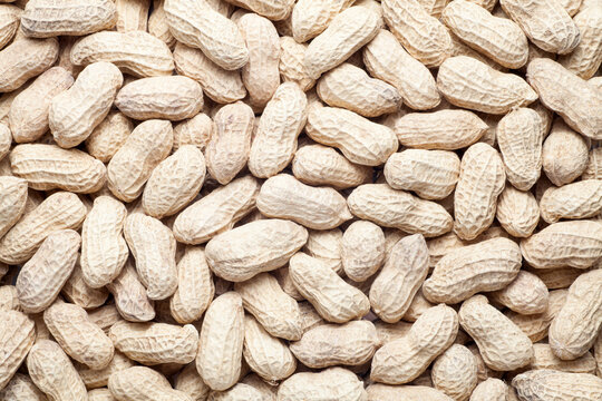 unpeeled peanut texture, food background