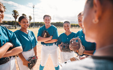 Team of women baseball players, given strategy and motivation by coach to win game. Winning in...