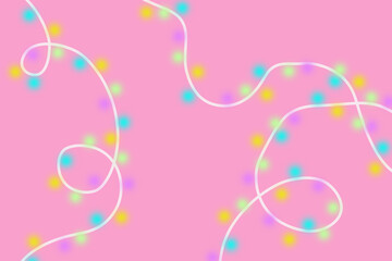 abstract colourful Christmas lights on pink background