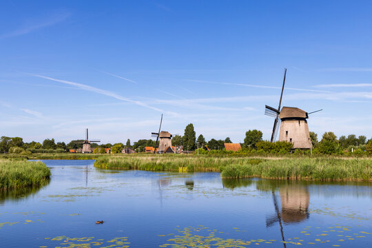 Row traditional windmill at Molenkade Hoornse Vaart in North Holland in The Netherlands