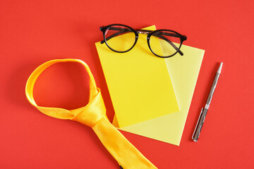 happy father's day tie, funny glasses, pen, mockup notepad and mustache, father's day, yellow items on red background