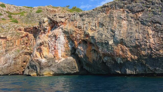 Punta Meliso where Ionian Sea meets Adriatic water seen from sailing moving boat. Italy