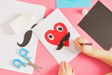 child makes a card for father's day, red paper heart with mustache, card for dad step by step instructions