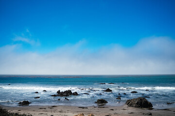 Pacific ocean beach with rocks