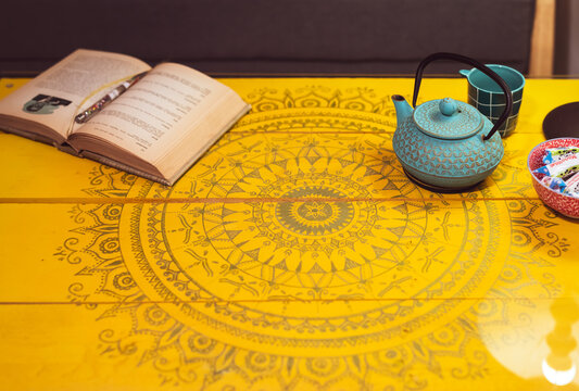 Beautiful Wooden Yellow Table Surface With Mandala Hand Drawings