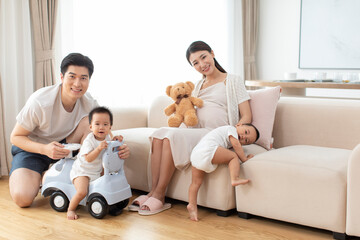 Happy young family playing at home