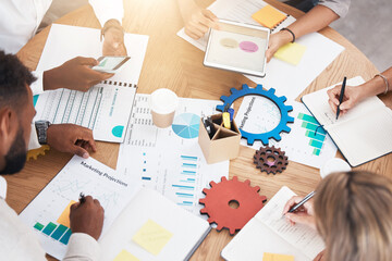 Architects, drawings, engineers and planning in a brainstorming session for a new construction project. Team of young engineers measuring and analyzing plans for a new development.