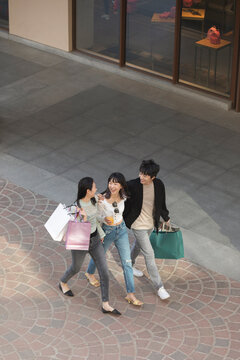 Happy Young Friends Shopping Together