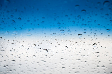 water droplets on glass sky background